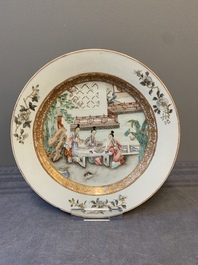 A fine pair of Chinese Canton famille rose 'ladies in the garden' plates, Yongzheng/Qianlong