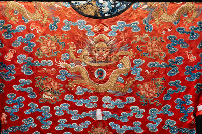 A fine Chinese gold thread embroidered red-ground silk noble lady&rsquo;s 'dragon' robe, 18/19th C.