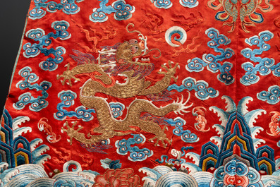 A fine Chinese gold thread embroidered red-ground silk noble lady&rsquo;s 'dragon' robe, 18/19th C.