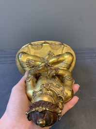 A Sino-Tibetan gilt bronze Virūpa, 19th C.