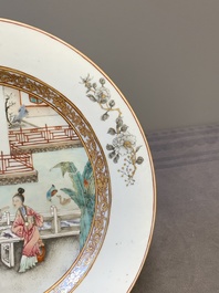 A fine pair of Chinese Canton famille rose 'ladies in the garden' plates, Yongzheng/Qianlong
