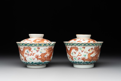 Two famille rose 'dragon' bowls and covers and a plate, Qianlong and Guangxu marks, 19/20th C.