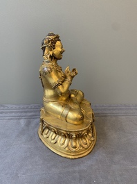 A Sino-Tibetan gilt bronze Virūpa, 19th C.