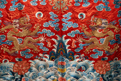 A fine Chinese gold thread embroidered red-ground silk noble lady&rsquo;s 'dragon' robe, 18/19th C.