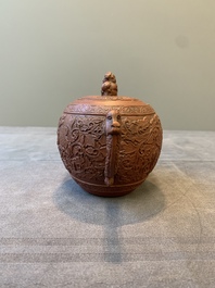 A Chinese Yixing stoneware teapot with boys among flower scrolls, Kangxi