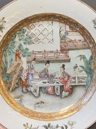 A fine pair of Chinese Canton famille rose 'ladies in the garden' plates, Yongzheng/Qianlong