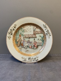A fine pair of Chinese Canton famille rose 'ladies in the garden' plates, Yongzheng/Qianlong
