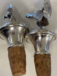 Two silver bottle stoppers, a tobacco box and a baby rattle with red coral teether, Germany, 19/20th C.