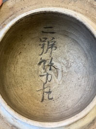 A Chinese wucai 'boy and peony scroll' vase and cover, 17th C.