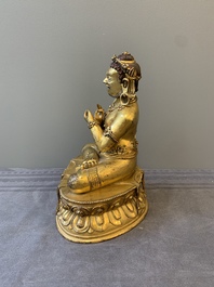 A Sino-Tibetan gilt bronze Virūpa, 19th C.