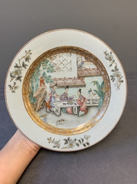 A fine pair of Chinese Canton famille rose 'ladies in the garden' plates, Yongzheng/Qianlong