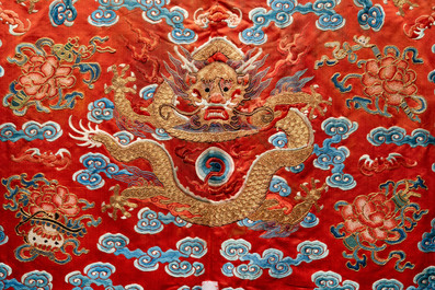 A fine Chinese gold thread embroidered red-ground silk noble lady&rsquo;s 'dragon' robe, 18/19th C.