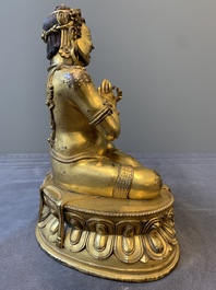 A Sino-Tibetan gilt bronze Virūpa, 19th C.