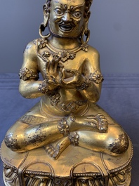 A Sino-Tibetan gilt bronze Virūpa, 19th C.