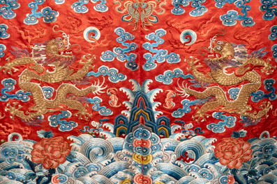 A fine Chinese gold thread embroidered red-ground silk noble lady&rsquo;s 'dragon' robe, 18/19th C.