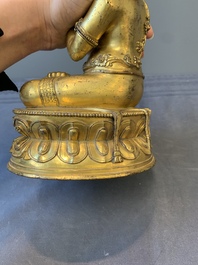 A Sino-Tibetan gilt bronze Virūpa, 19th C.