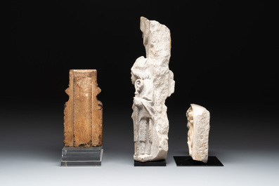 Two sculptured marble fragments and a limestone fragment, France, 14/16th C.