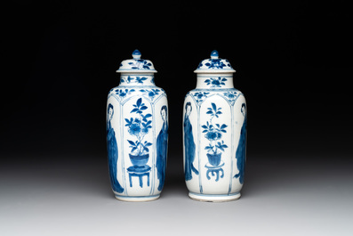 A pair of Chinese blue and white 'Long Eliza' vases and covers, jade mark, Kangxi