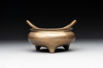 A Chinese bronze tripod censer with two handles, Xuande mark, 19th C.