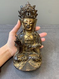 A Chinese parcel-gilt bronze Guanyin, Ming