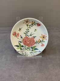 Three Chinese famille rose 'birds and flowers' cups and saucers, Yongzheng