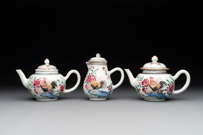 Two Chinese famille rose 'rooster' teapots, a milk jug and four handled cups, Yongzheng
