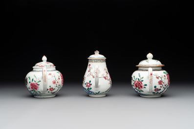 Two Chinese famille rose 'rooster' teapots, a milk jug and four handled cups, Yongzheng