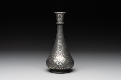 A bidri vase, a steel hookah cup and three copper alloy hookah mounts, India/Persia, 19th C.