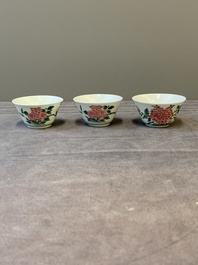Three Chinese famille rose 'birds and flowers' cups and saucers, Yongzheng