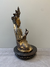 A Chinese parcel-gilt bronze Guanyin, Ming