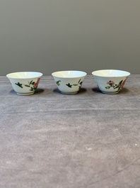 Three Chinese famille rose 'birds and flowers' cups and saucers, Yongzheng