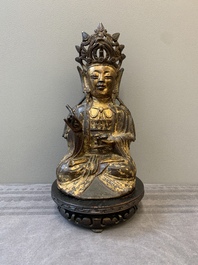 A Chinese parcel-gilt bronze Guanyin, Ming
