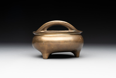 A Chinese bronze tripod censer with two handles, Xuande mark, 19th C.