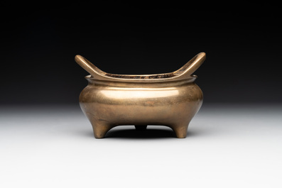 A Chinese bronze tripod censer with two handles, Xuande mark, 19th C.