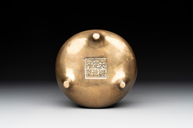 A Chinese bronze tripod censer with two handles, Xuande mark, 19th C.