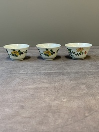 Three Chinese famille rose 'birds and flowers' cups and saucers, Yongzheng