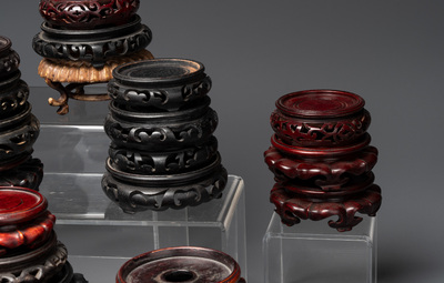 A large collection of 87 Chinese wooden stands, 19/20th C.