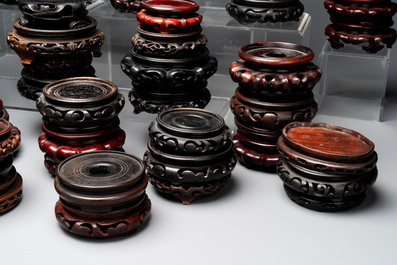 A large collection of 87 Chinese wooden stands, 19/20th C.