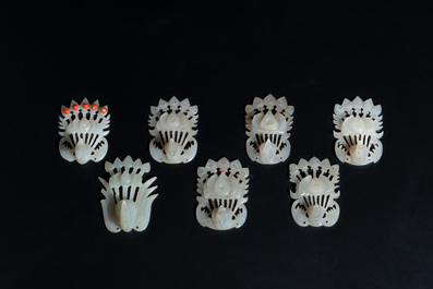 34 Chinese white and celadon jade phoenix-form hat ornaments, 19th C.