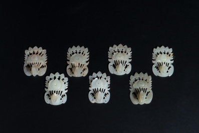 34 Chinese white and celadon jade phoenix-form hat ornaments, 19th C.