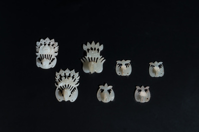 34 Chinese white and celadon jade phoenix-form hat ornaments, 19th C.