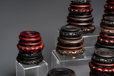 A large collection of 87 Chinese wooden stands, 19/20th C.