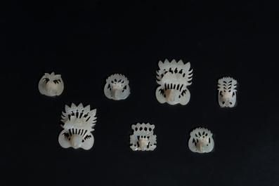 34 Chinese white and celadon jade phoenix-form hat ornaments, 19th C.