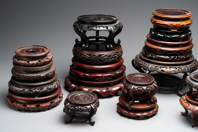A collection of 26 Chinese wooden stands, 19/20th C.