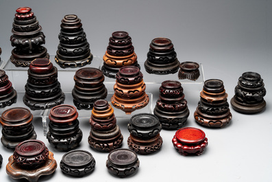 A large collection of 91 Chinese wooden stands, 19/20th C.