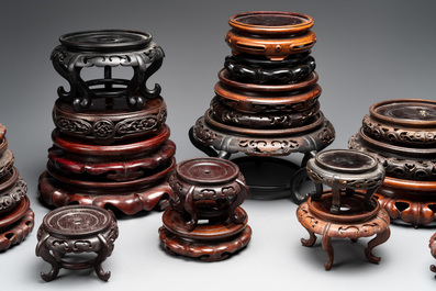 A collection of 26 Chinese wooden stands, 19/20th C.
