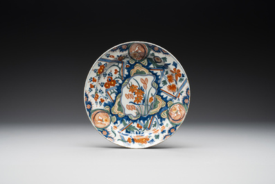 Three polychrome Dutch Delft 'lightning' plates and one dish, 1st quarter 18th C.
