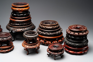 A collection of 26 Chinese wooden stands, 19/20th C.