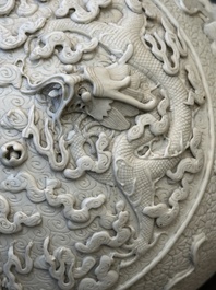 A Chinese white-glazed biscuit 'hu' vase with dragons, Qianlong mark, 19/20th C.