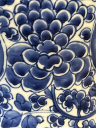 A Chinese blue and white 'antiquities and peony scrolls' vase and cover, Kangxi